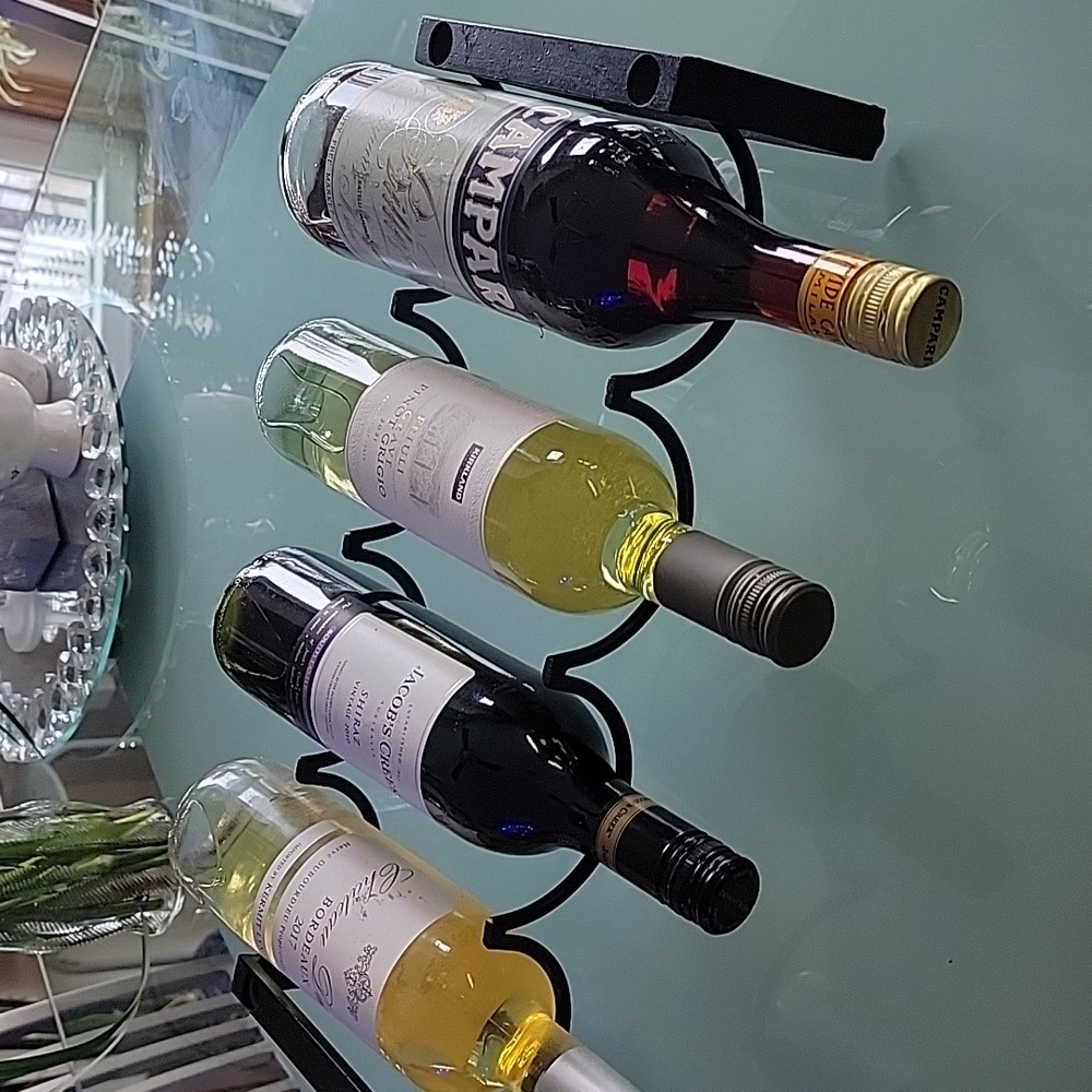 1 level wine rack.. wrought iron composition.  4 bottle capacity.